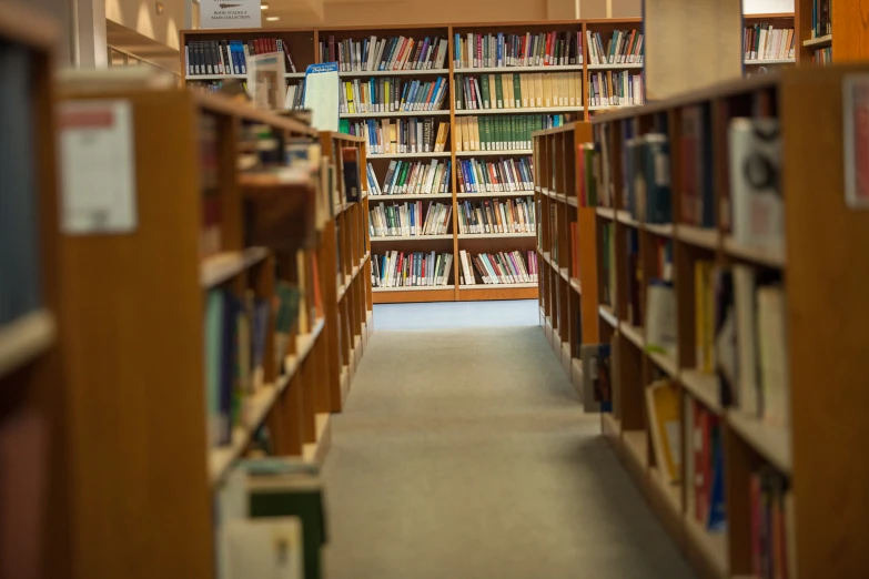 a long room with a lot of book shelves