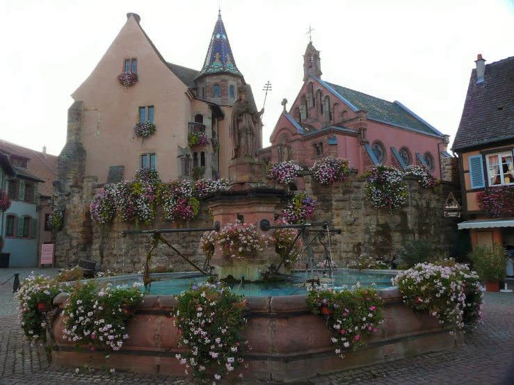 a flower pot sits in the center of an old town