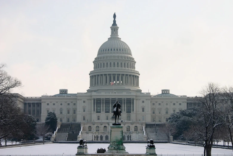 a picture of the u s capitol building from across the water