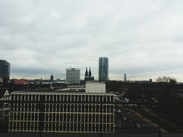 a city view with buildings and some clouds