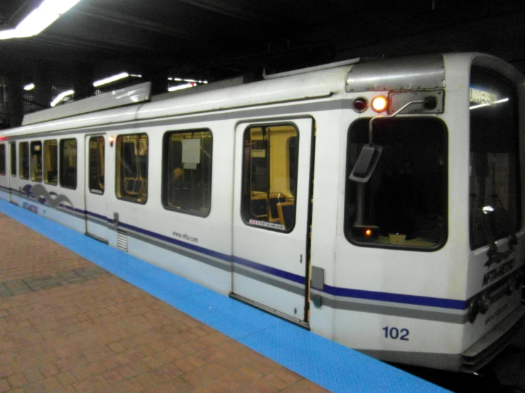 an empty subway car parked at the platform