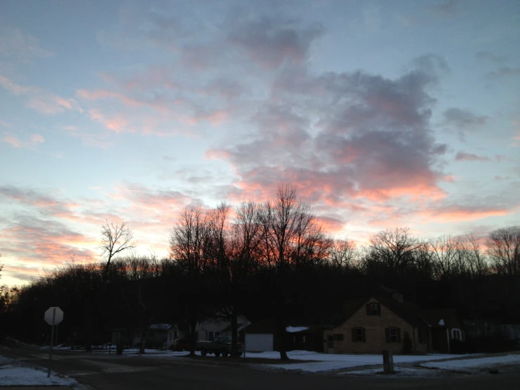 a bright sunset reflecting off the clouds in the sky