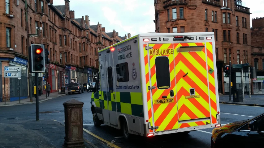 an ambulance parked on the side of the street