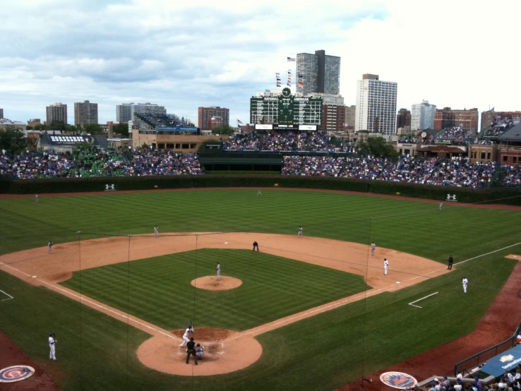 many people are playing baseball on the field