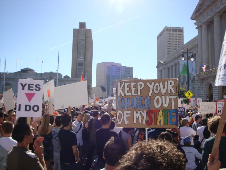 a large group of people holding up signs