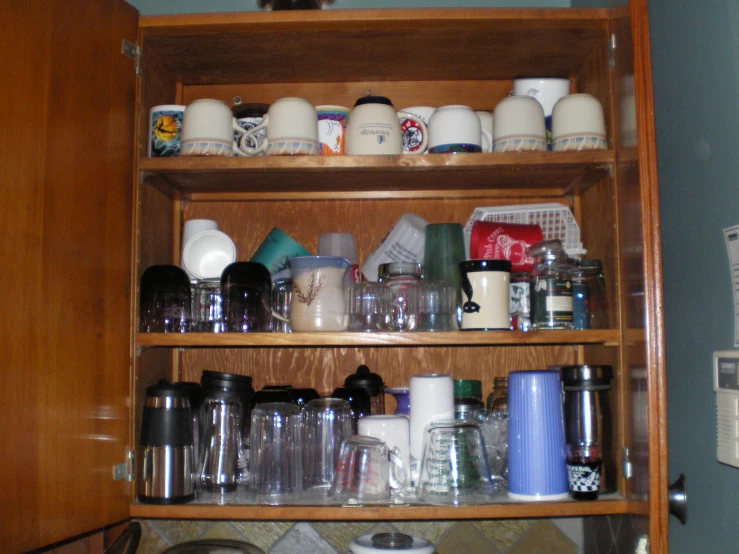 the pantry shelves have various kinds of kitchen items