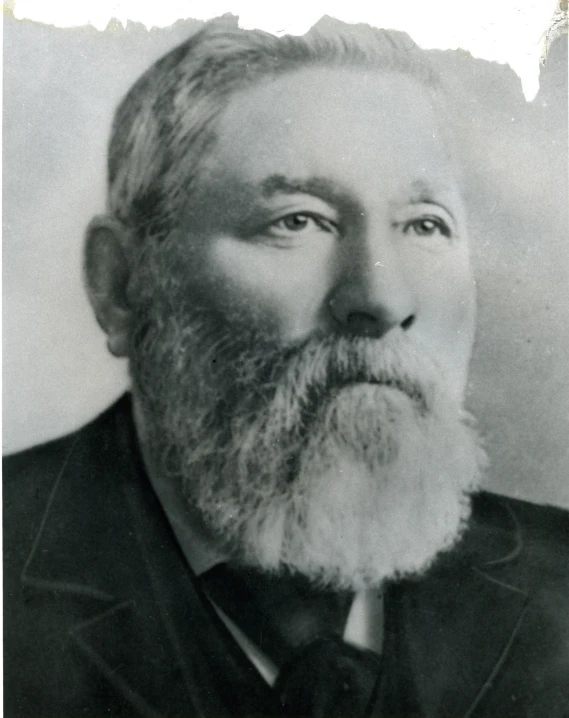 an old black and white po of a man with long beard