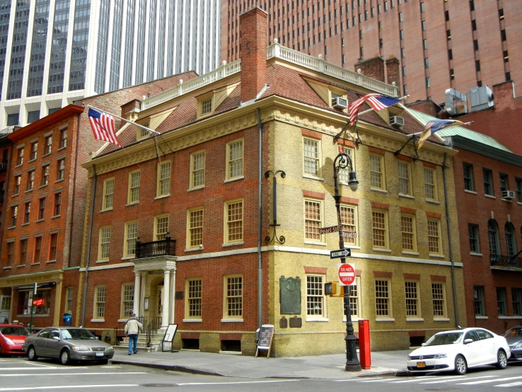 a street scene with focus on an old building