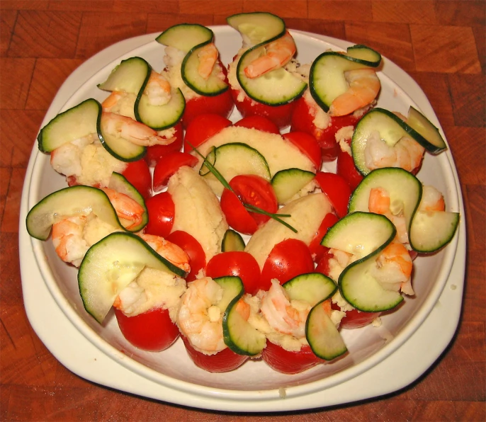 a plate full of fresh vegetables made with shrimp