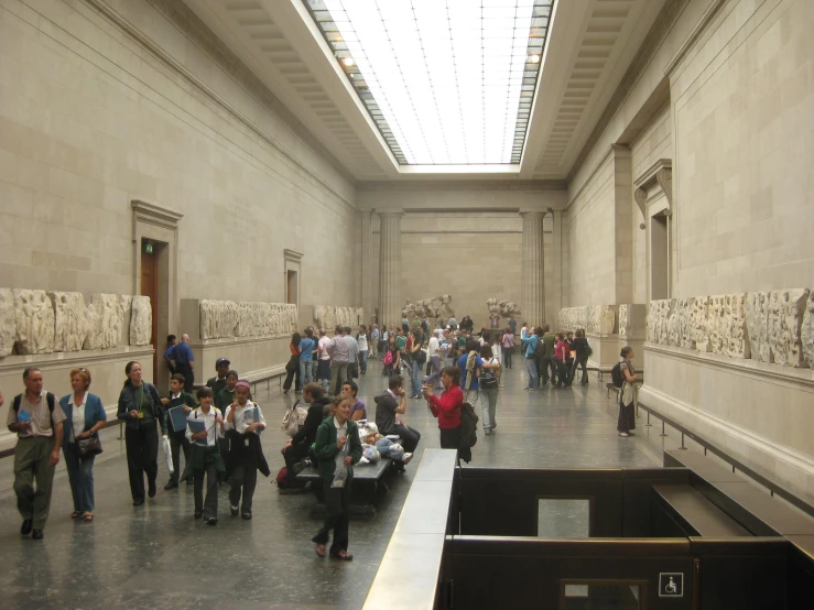 an image of many people going through the museum