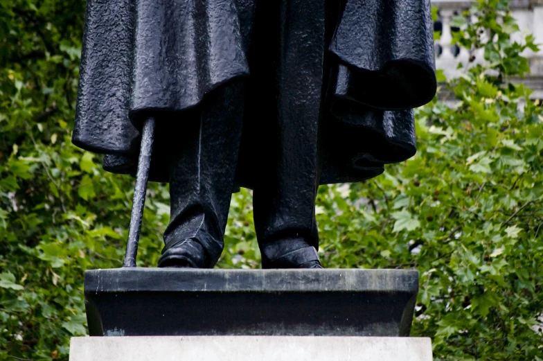 a statue with trees in the background