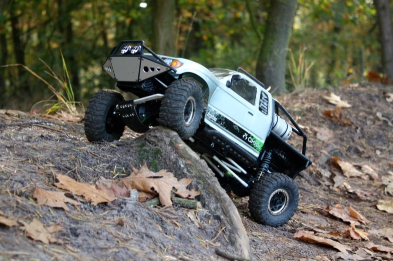 a white truck that is sitting in the dirt