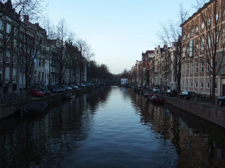 there is a river that has buildings along the bank