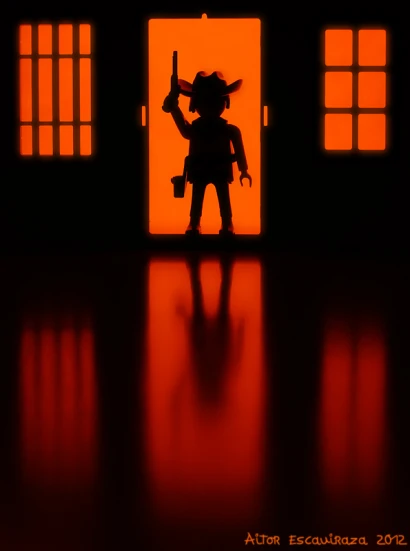 the silhouette of a toy person with weapons