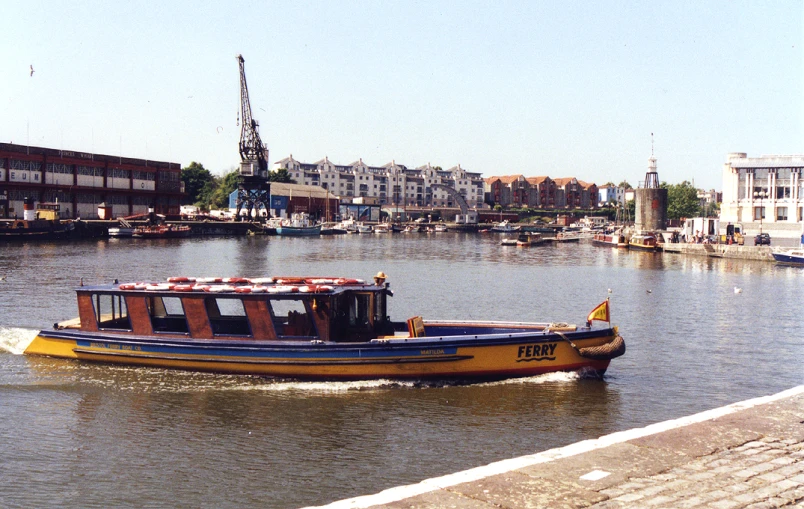 a barge is heading down the river as other boats travel on it