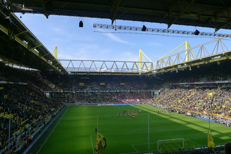 a large sports stadium with a soccer match in progress