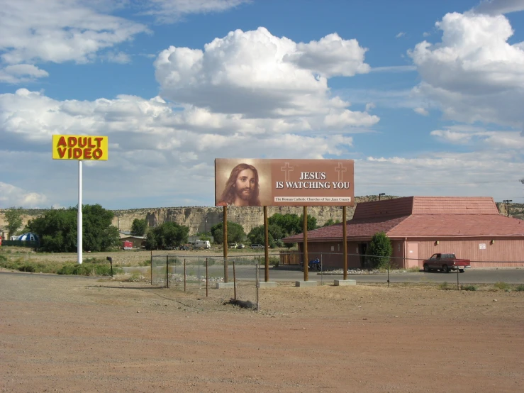 a sign and billboard advertising some kind of show