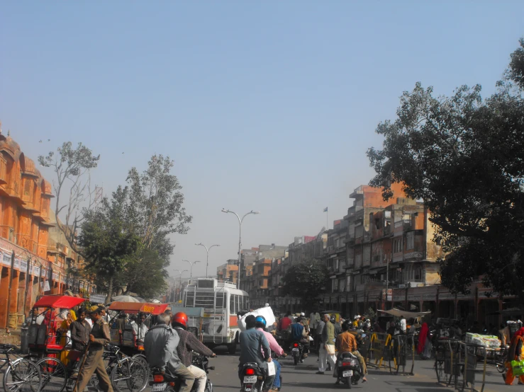 a street with several motorcycles and people in it