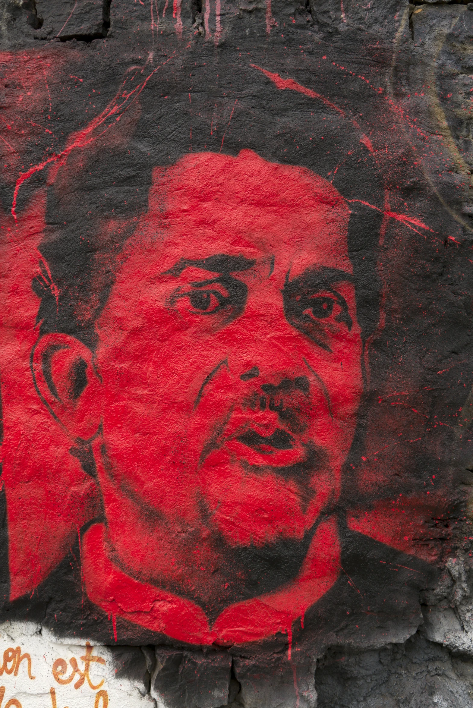 a red and black drawing of a man on a red background