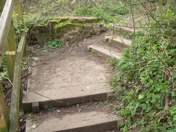 a stone staircase with several steps made of wood