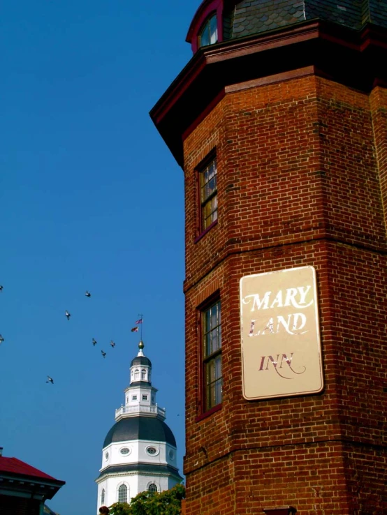 a building with some birds flying around