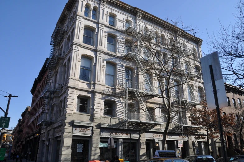 an old, white building in a european town