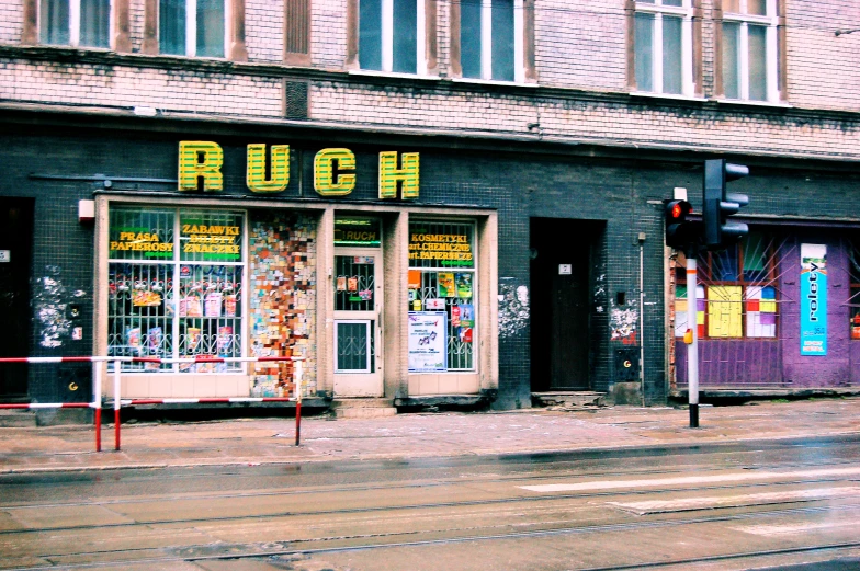 a row of shops across the street from a building