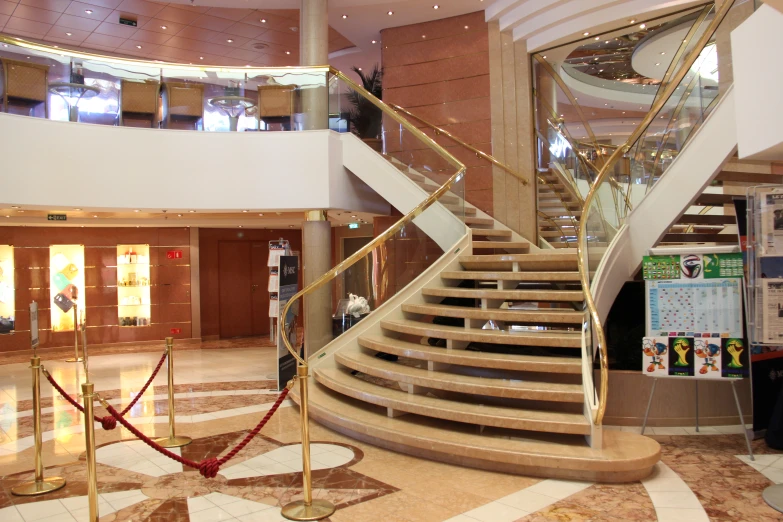 a stairwell next to a railing in the lobby