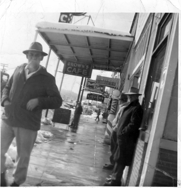 an older man is standing near two older men