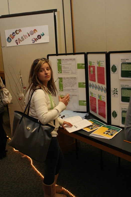 a person standing in front of two poster boards