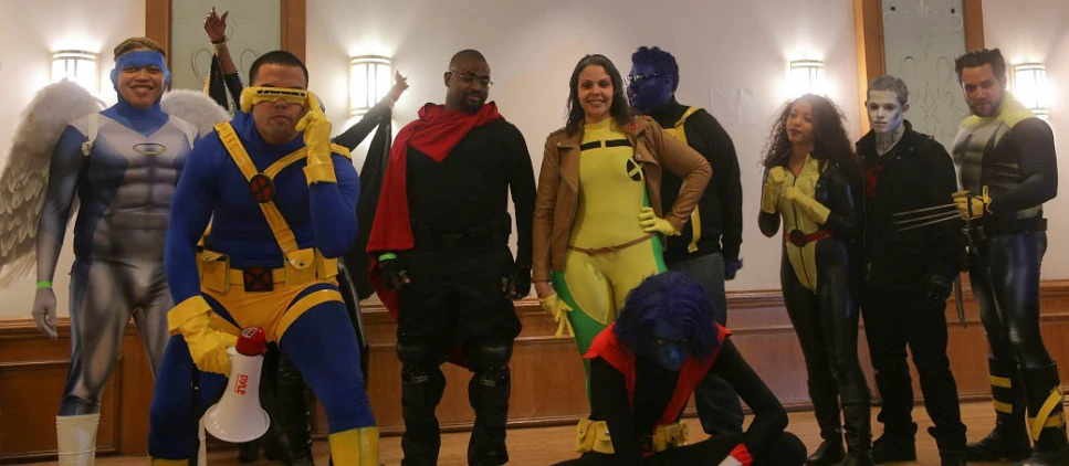 people standing next to each other in costumes