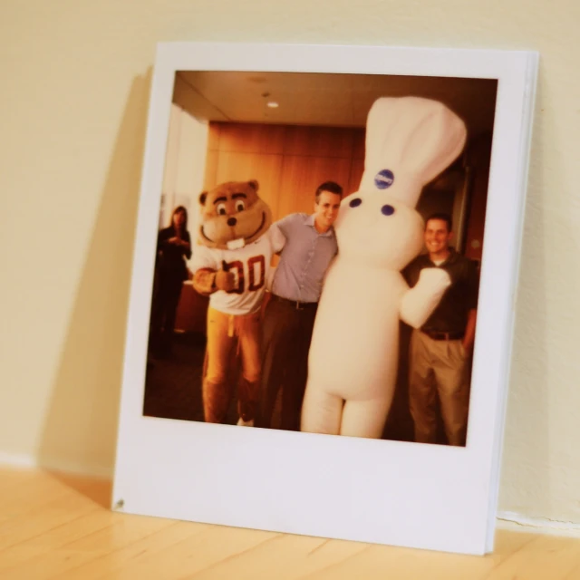 polaroid image of chef and bear with chef in kitchen setting