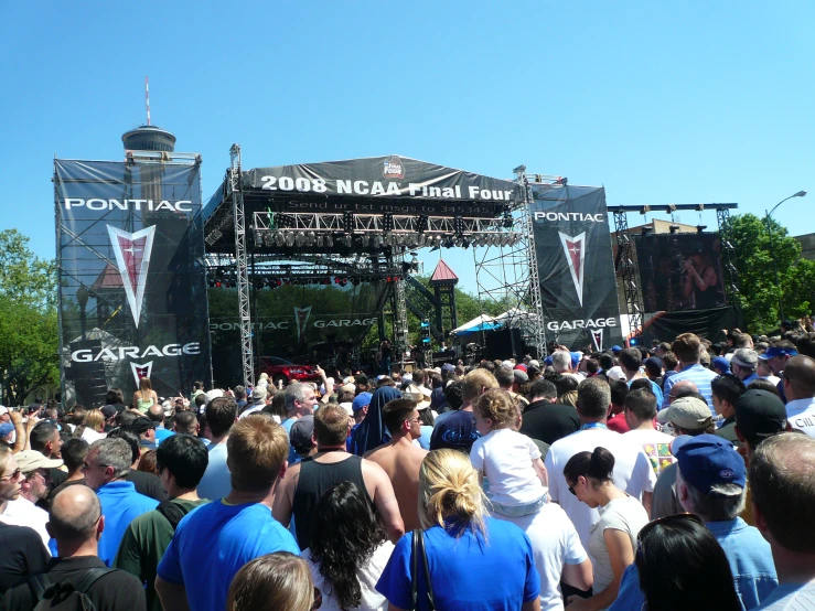 a group of people in front of a stage