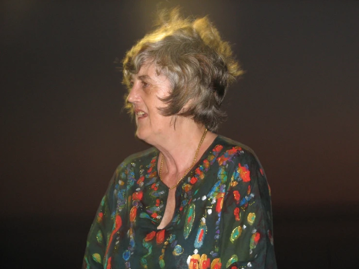 an older woman looking off into the distance with a very long hairdoed