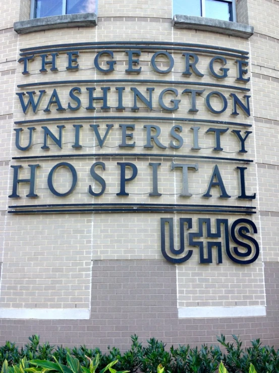 an ornate sign that says the george washington university hospital uhhs