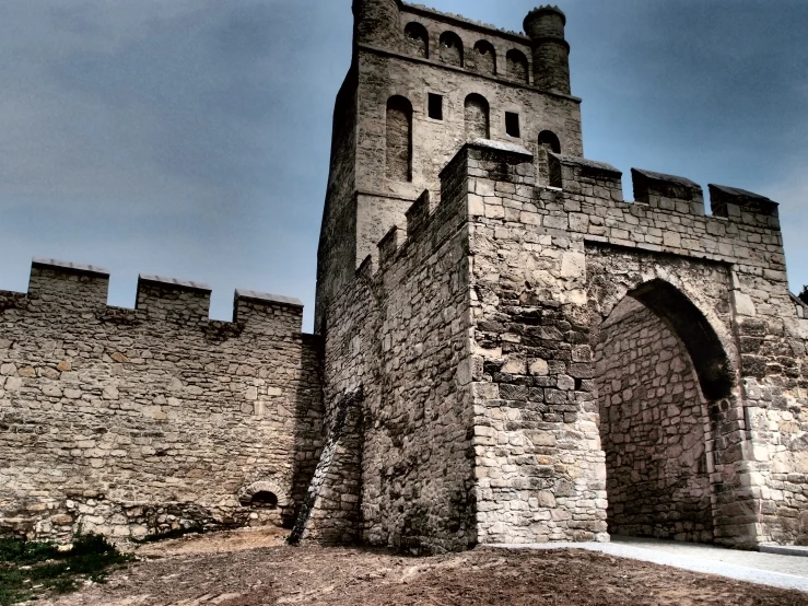 a castle with an arch in front and an entrance