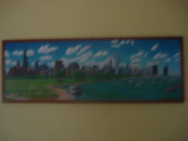 painting hanging up on a wall of a city skyline