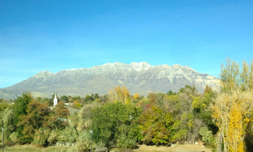 a view of the mountains through a glass window