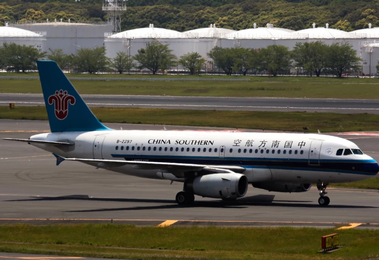 an airplane sits on the tarmac by itself