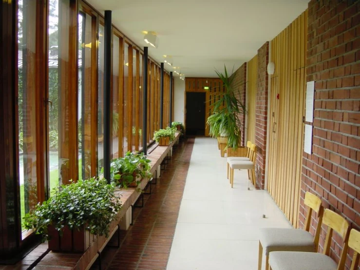 a row of planters along a long red brick walkway
