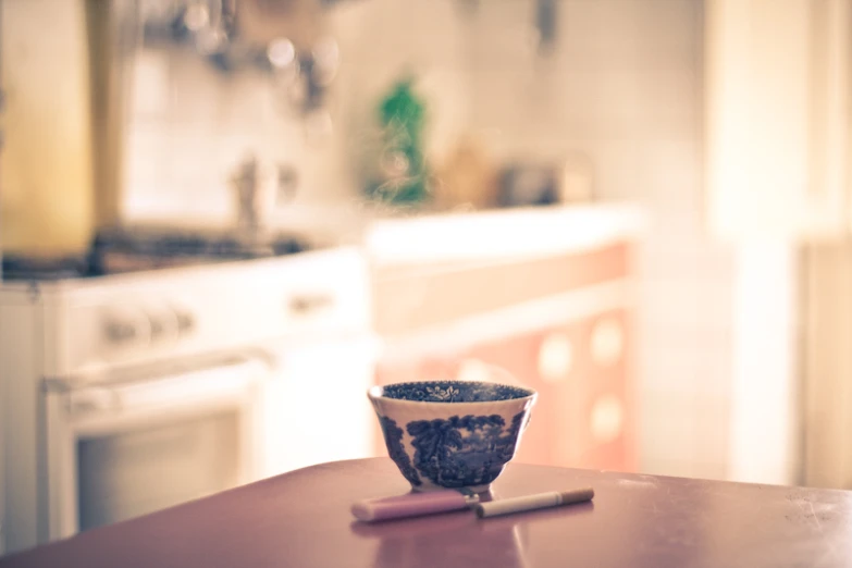 a close up view of a cup and a brush