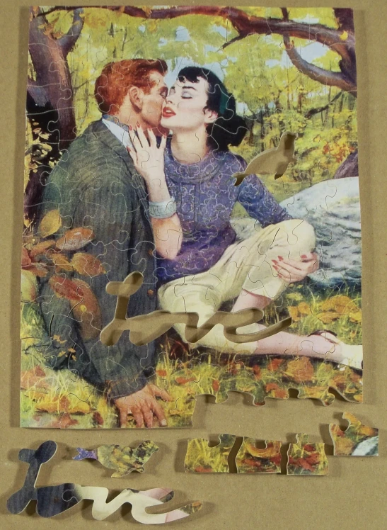 a man and woman kissing while surrounded by puzzle pieces