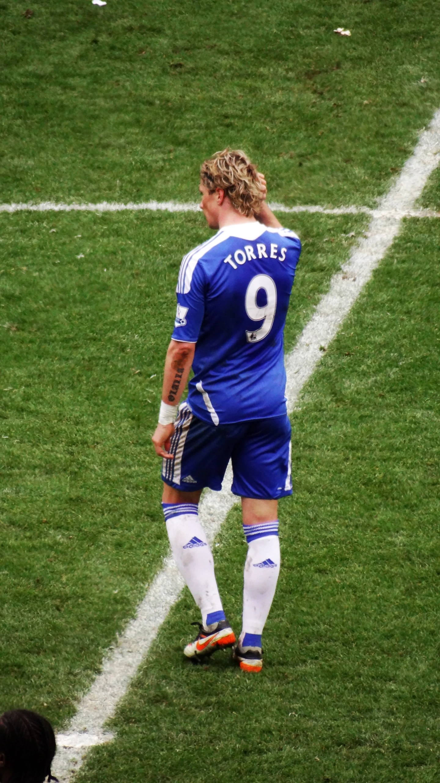 a male soccer player standing on a field