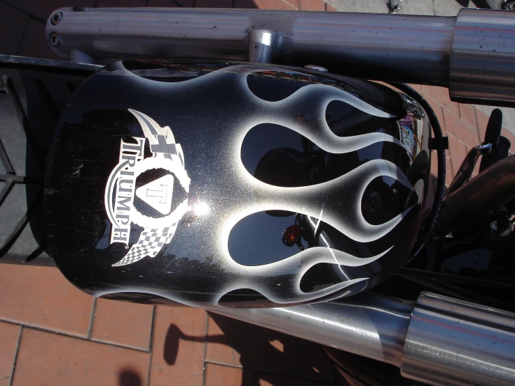 a close up view of a motorcycle's helmet on a bicycle