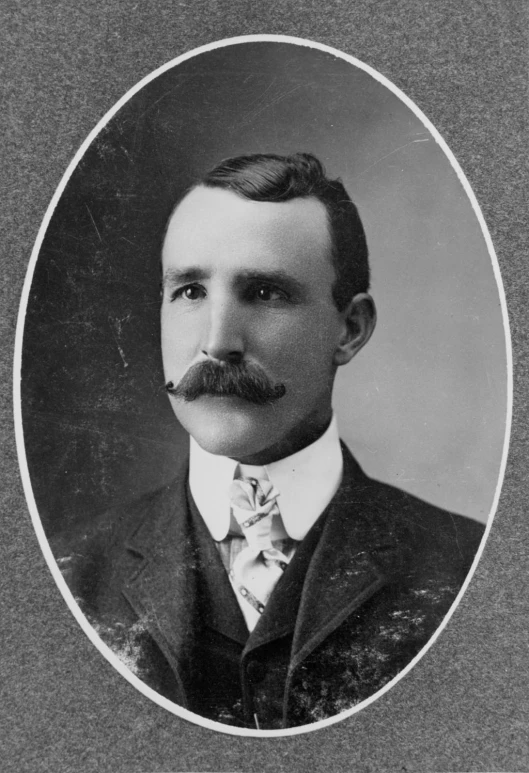 an old portrait of a man in a suit