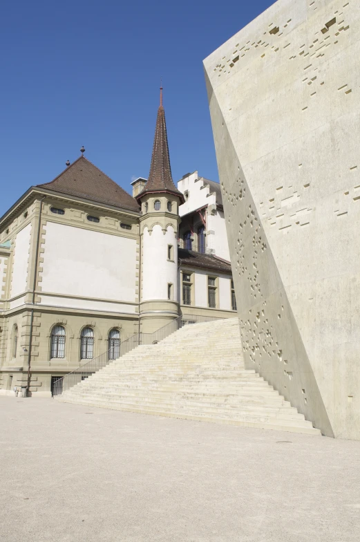 the building is located near the large stone stair