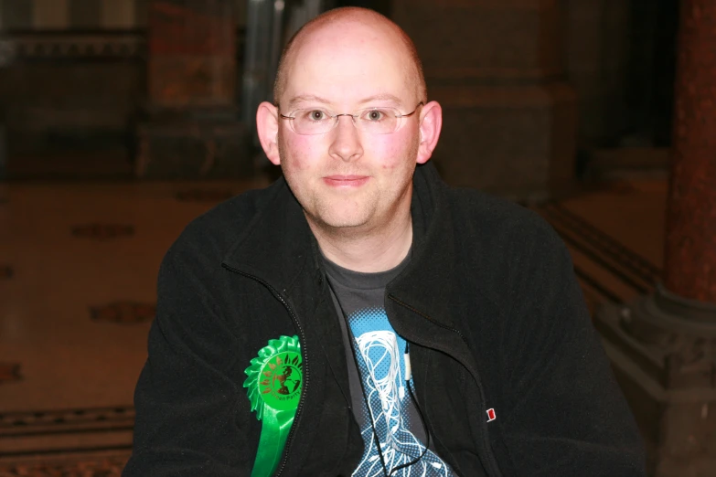 man with a green hair brush in front of him