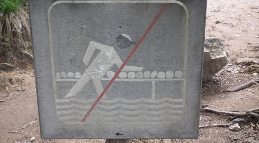 an altered sign with a picture of a swimmer under water