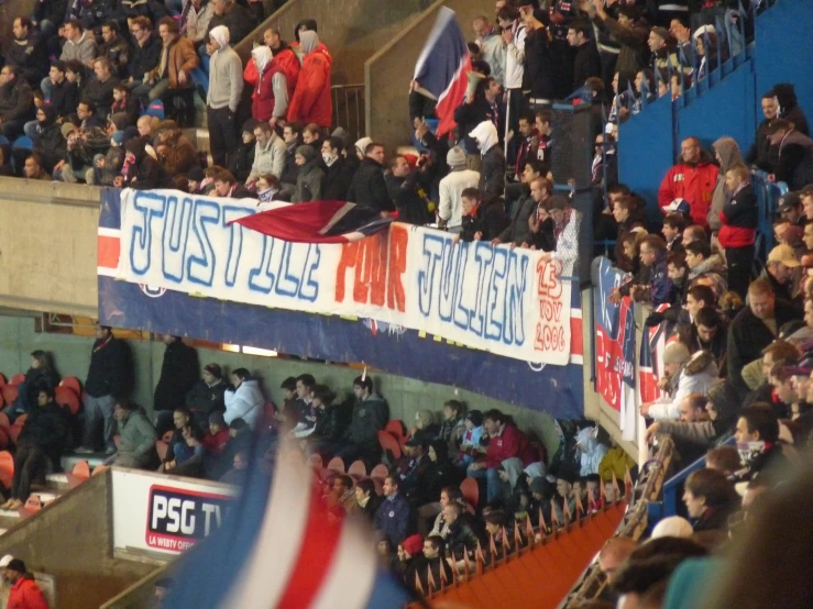 a group of fans are in a stadium