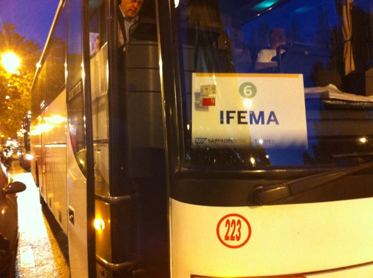 an empty bus parked in the dark in a city